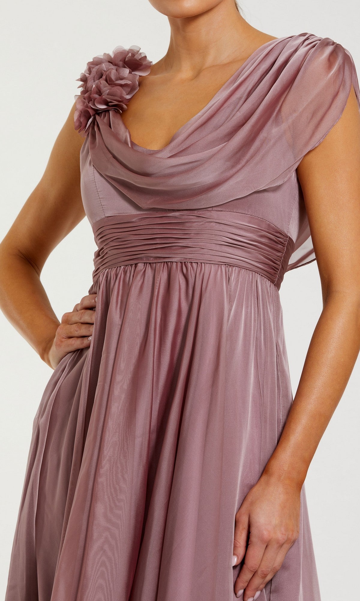 Wearing the Mac Duggal 68967 Tea-Length Party Dress in mauve, featuring a one-shoulder silhouette with a pleated bodice, gracefully draped fabric, and an oversized fabric flower accent at the shoulder—a sophisticated ensemble reminiscent of an elegant chiffon cocktail dress.